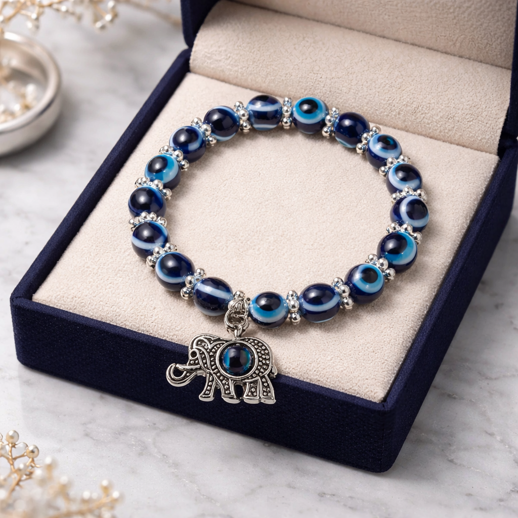 EVIL EYE BRACELET WITH ELEPHANT CHARM